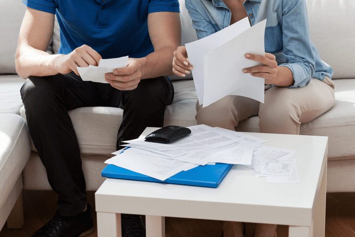 two people paying bills
