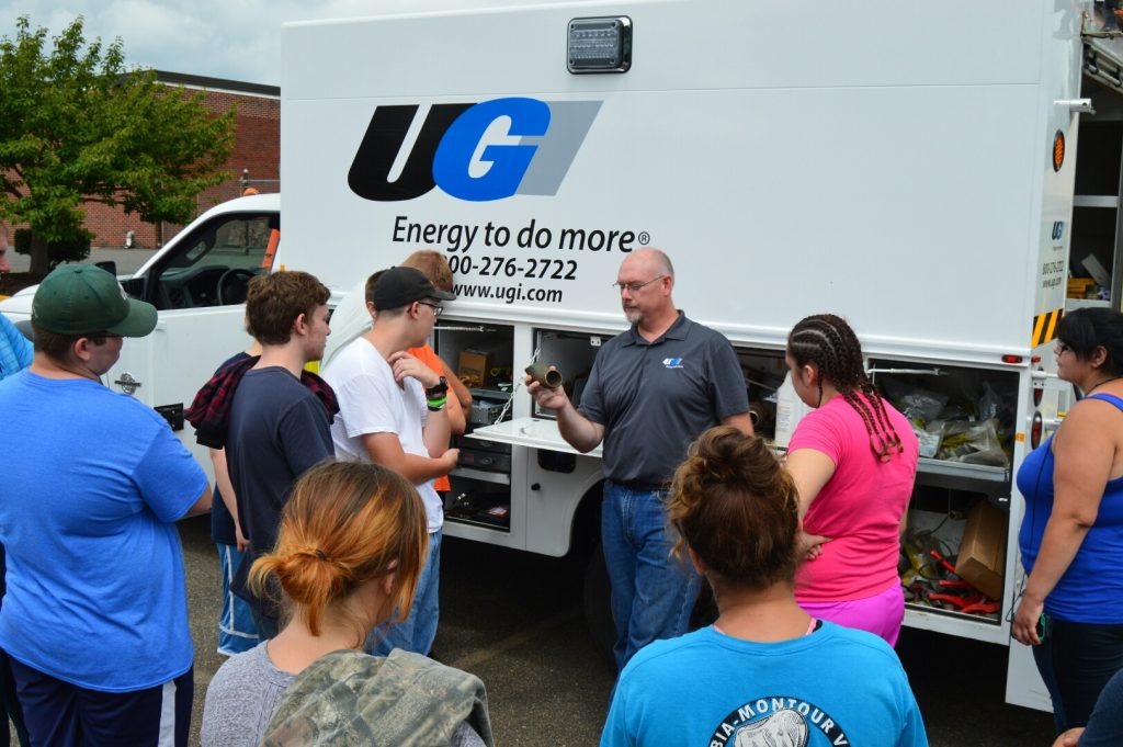 UGI employee teaches students in front of UGI truck