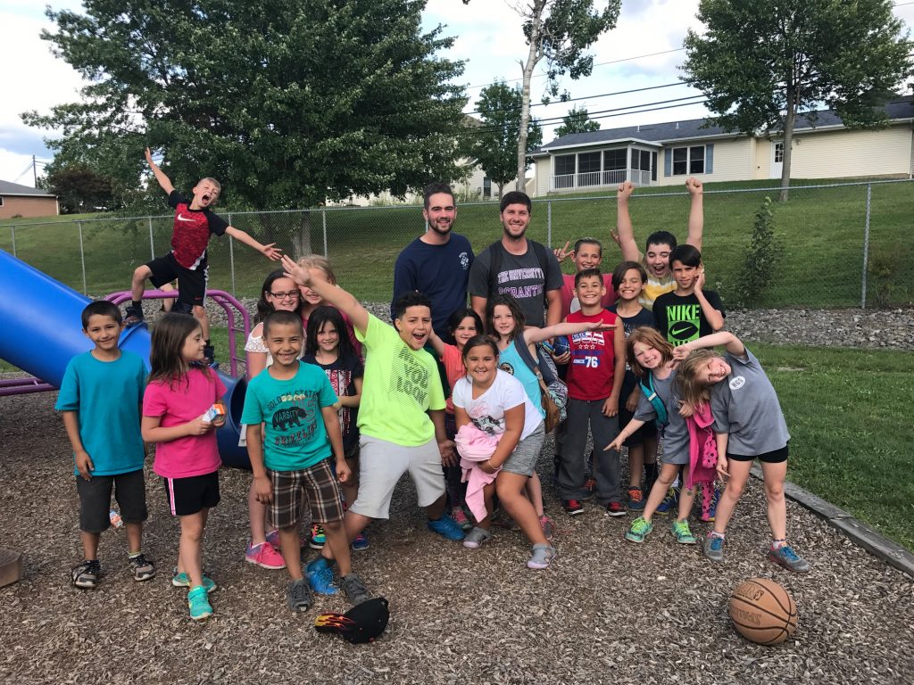 Kids pose near a playground at the YMCA of Greater Scranton.