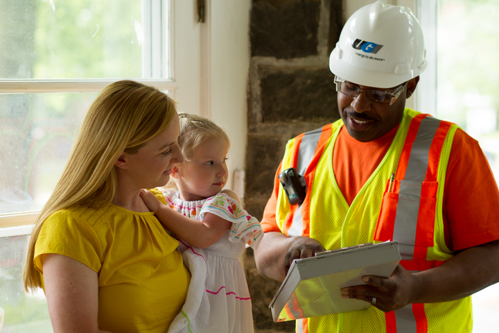 UGI employee with woman and child