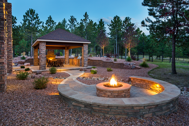 outdoor living space fueled by natural gas, including fire pit, fireplace, and grill.