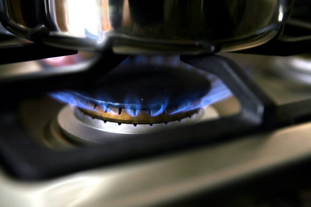 gas burner on stove with pot