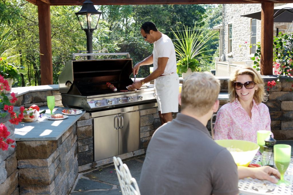 family grilling with natural gas grill