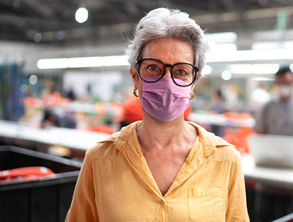 Factory employee wearing mask