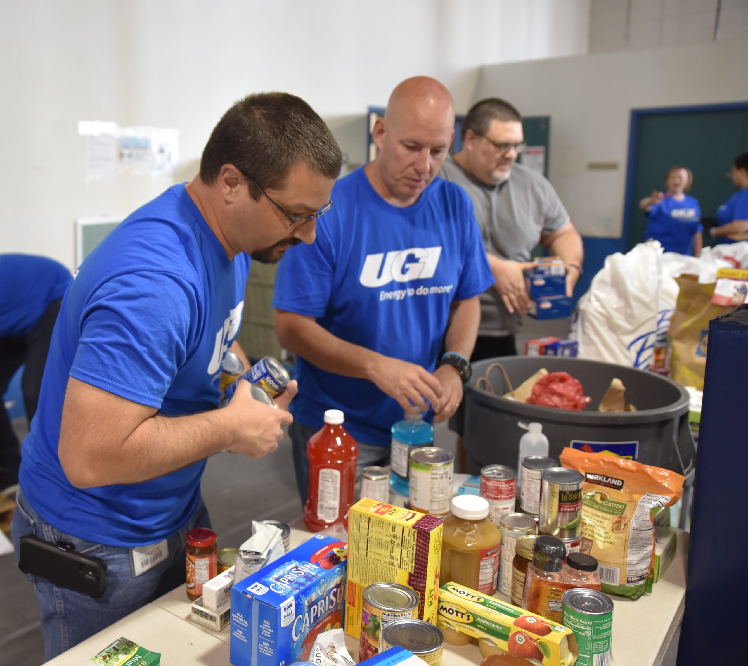 UGI employees package food donations.
