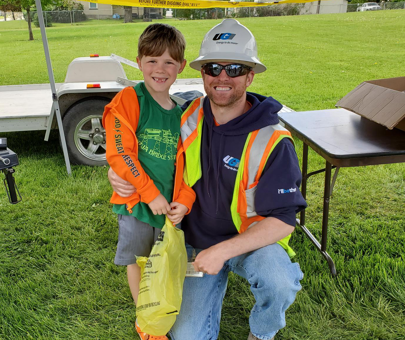 UGI field employee with child at an event