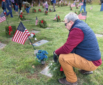 UGI employee at gravesite for veterans