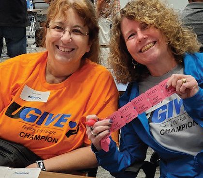UGI employees in UGI Gives shirts with raffle tickets