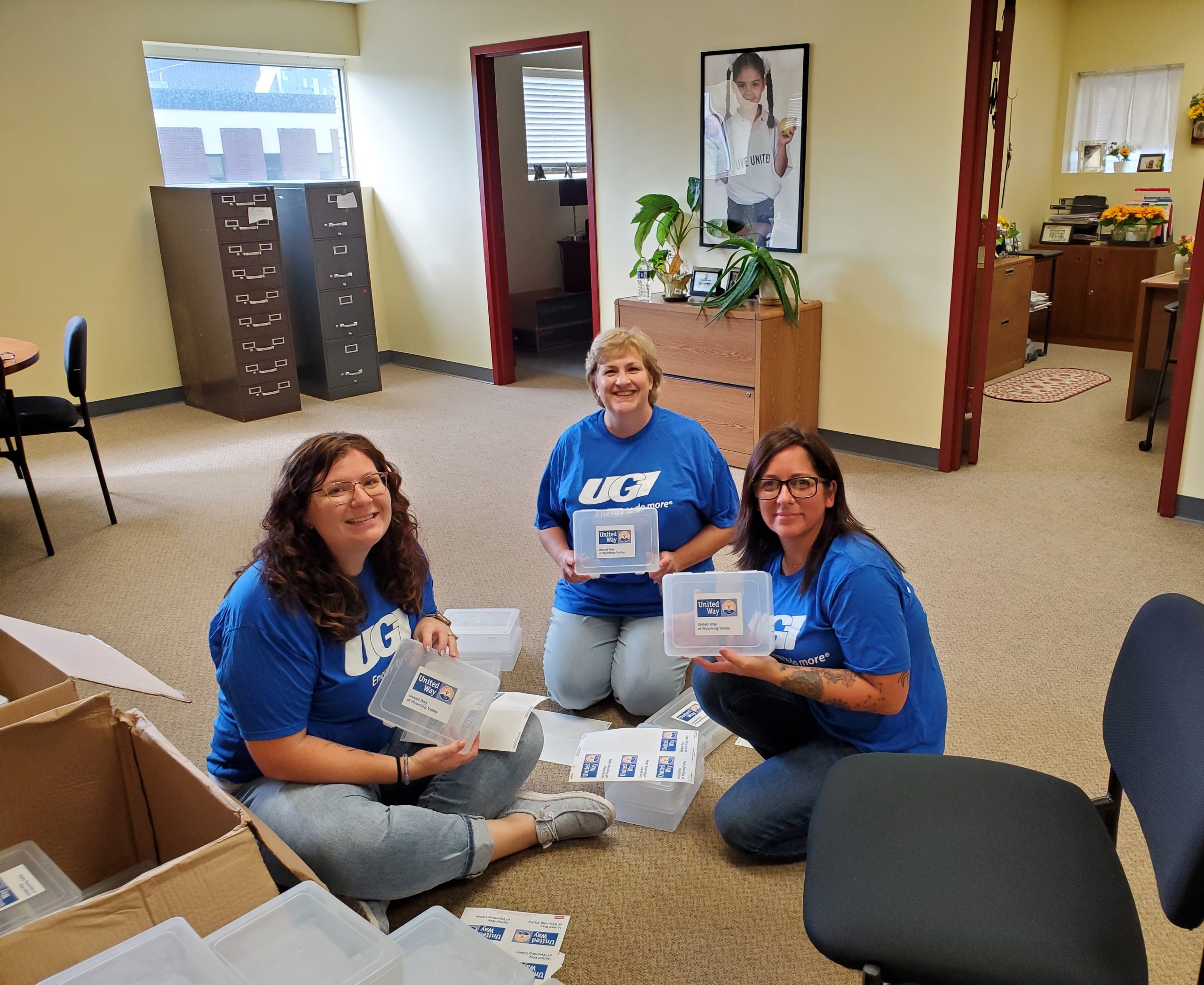 UGI employees sort school supplies.