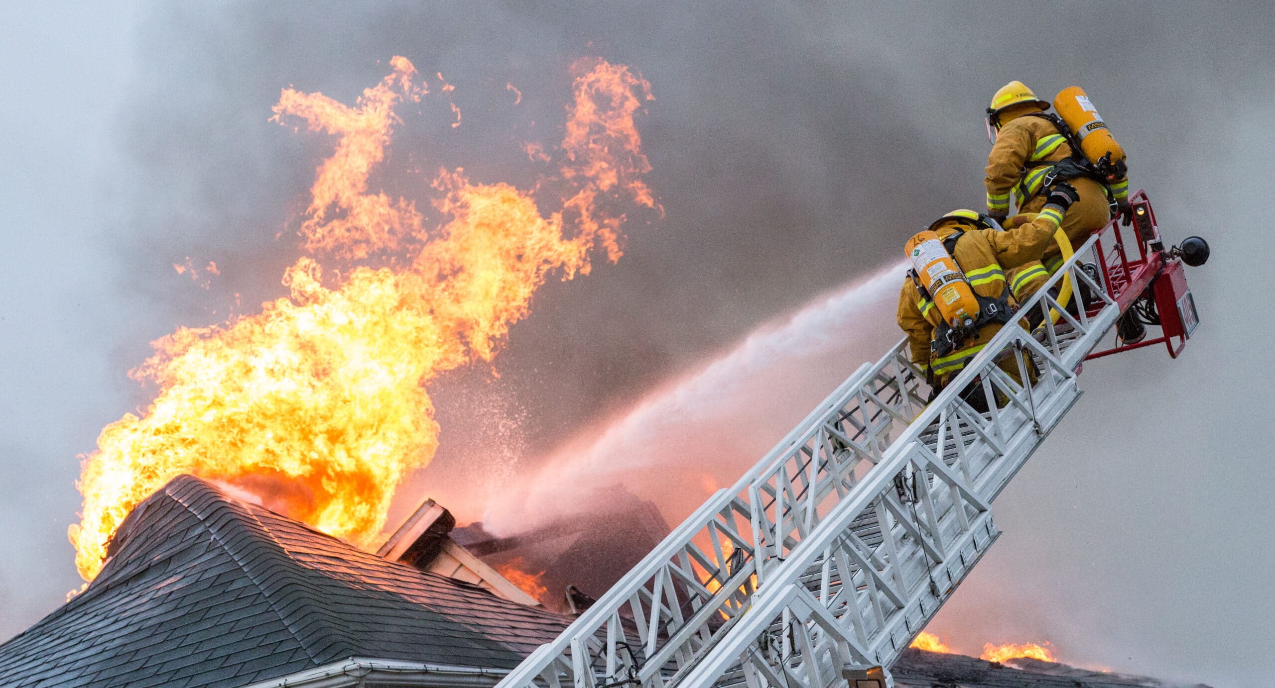 Firefighters fight home fire.