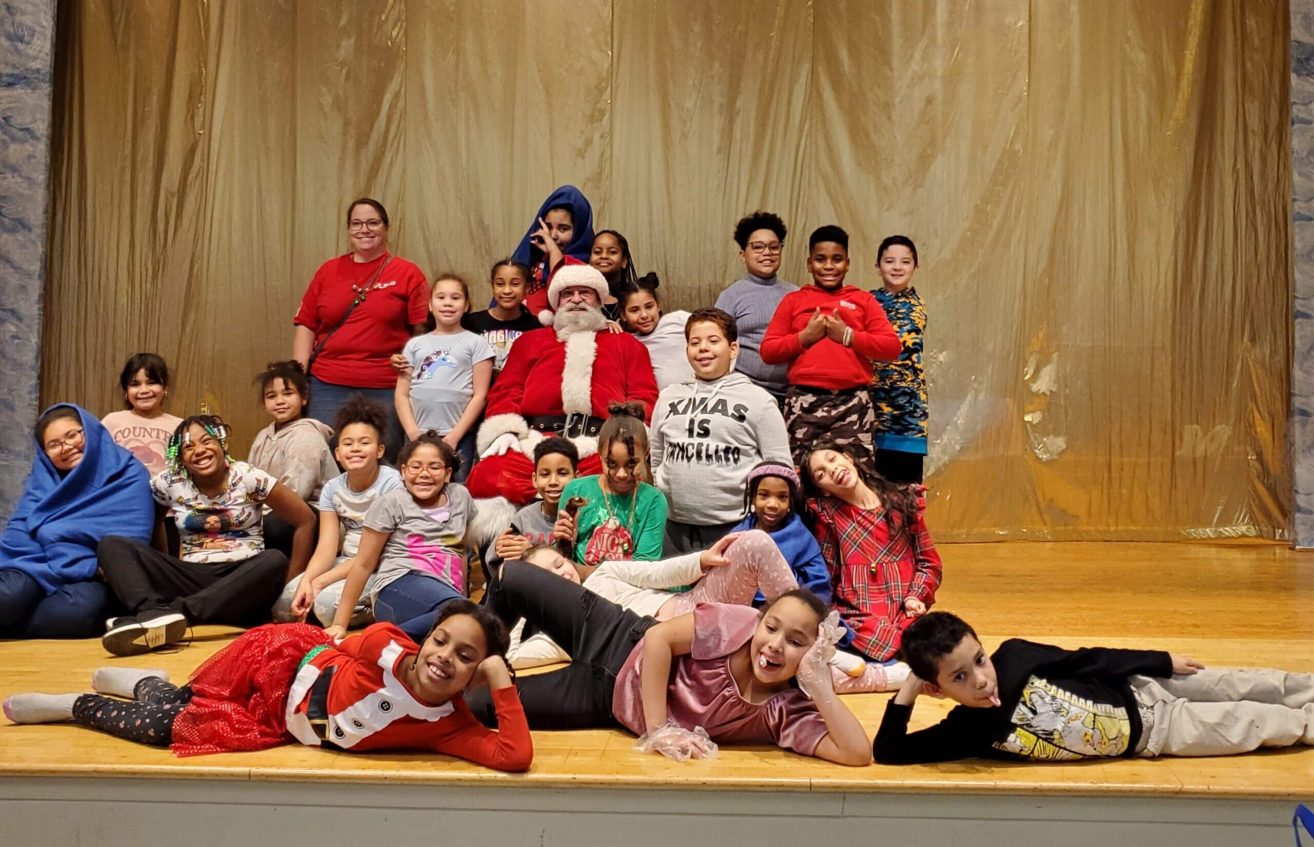 Children at Olivet Boys & Girl Club pose with Santa.