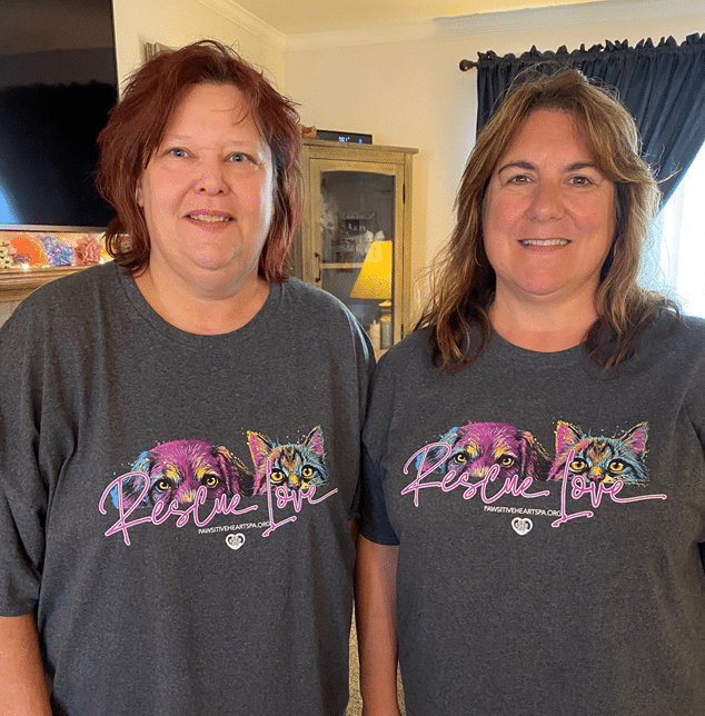 UGI employees stand together wearing pet rescue shirts.