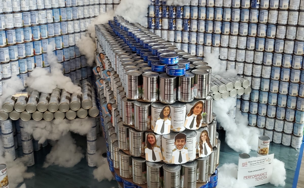Canned food made into a sculpture of an airplane.