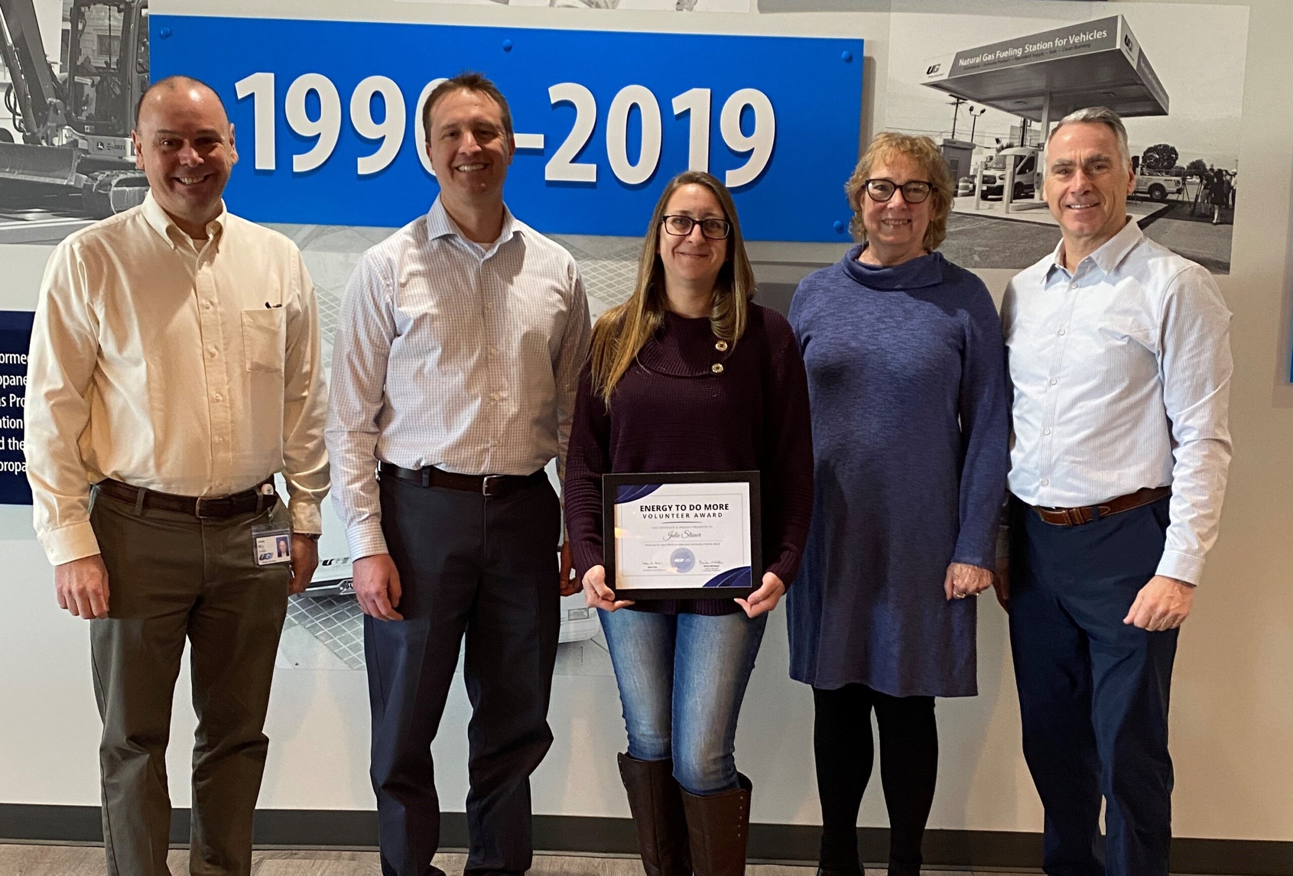 UGI employees stand with Julie who won this year's Energy To Do More Volunteer Award.