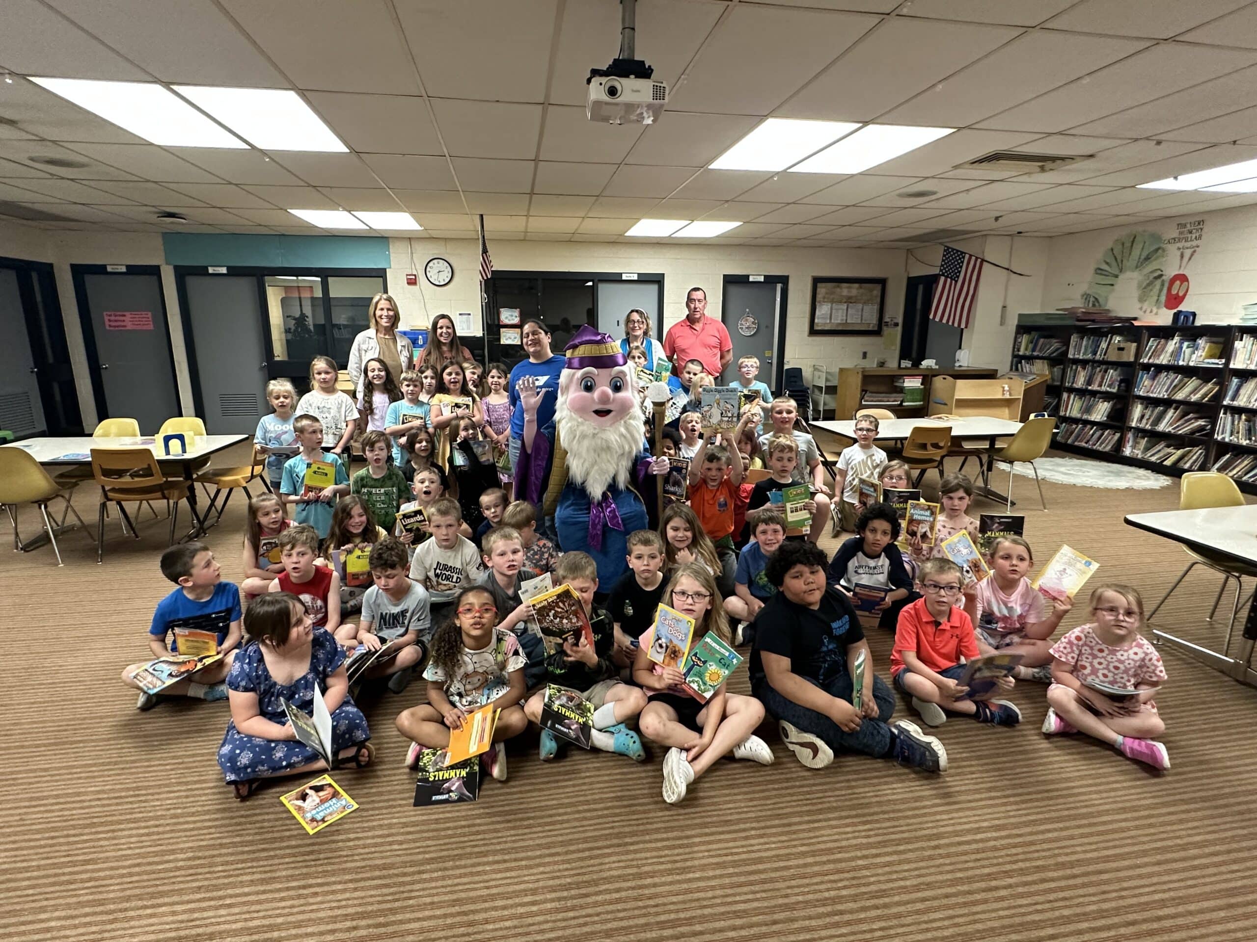 Smiling students pose with Reading Wizard