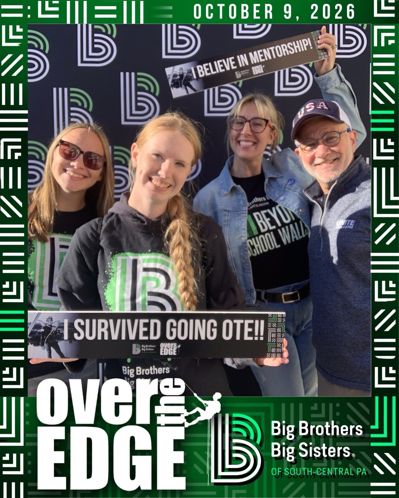 UGI employees and Beyond School Walls students pose in front of backdrop with signs about BBBS mission.