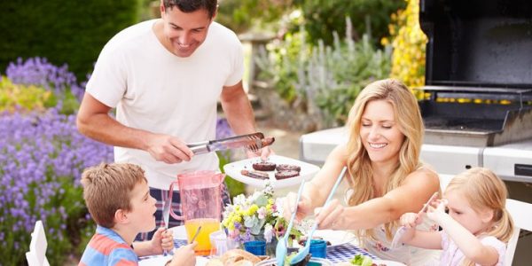 Family grilling on natural gas grill